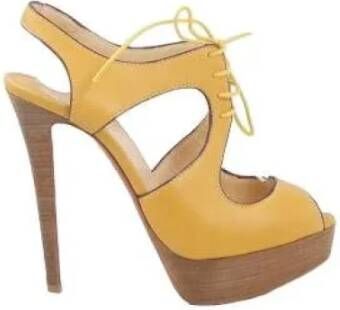 Christian Louboutin Pre-owned Leather heels Yellow Dames