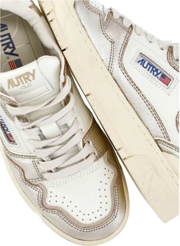 Autry Gouden leren sneakers met zilveren details Yellow Dames