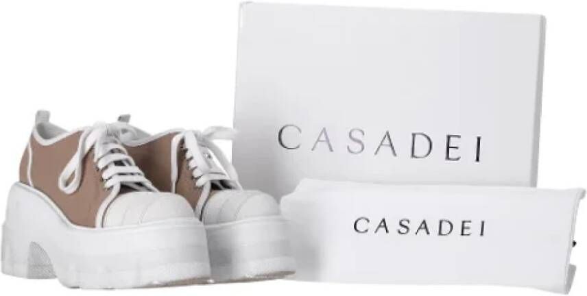 Casadei Pre-owned Coated canvas sneakers Brown Dames