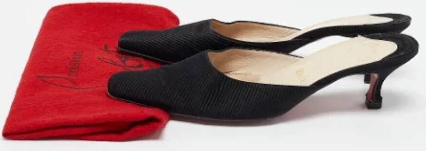 Christian Louboutin Pre-owned Fabric mules Black Dames