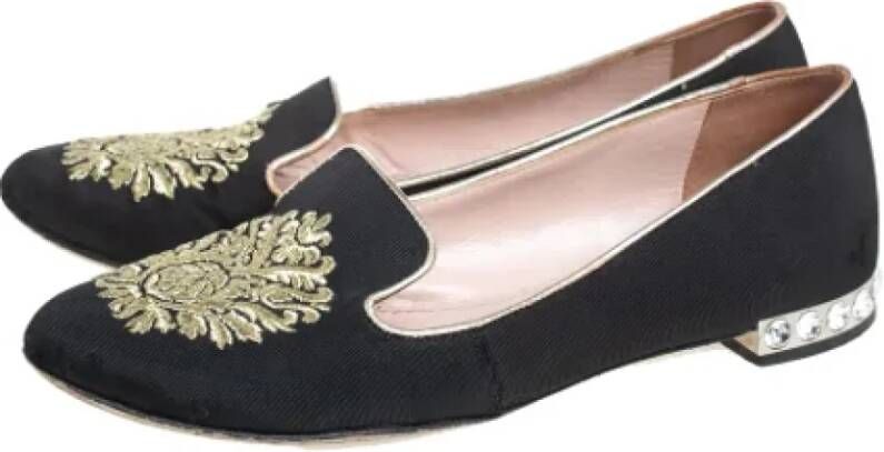 Miu Pre-owned Canvas flats Black Dames