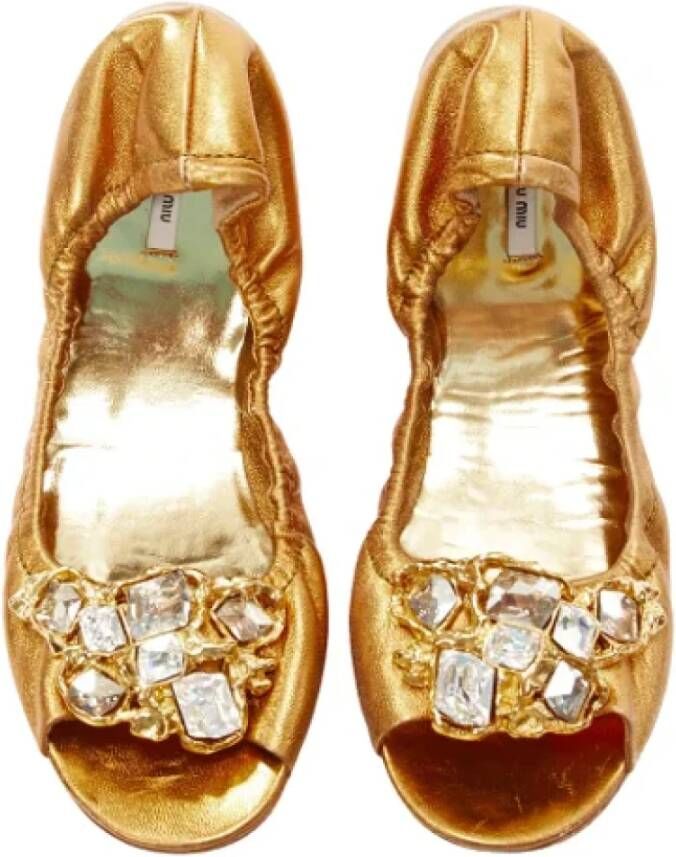 Miu Pre-owned Leather flats Yellow Dames