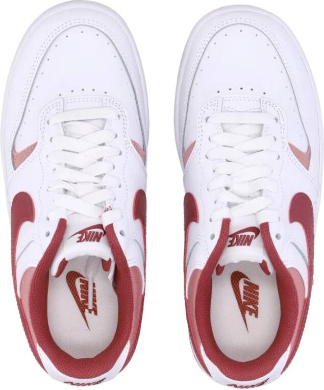 Nike Witte lage schoen met oranje accenten White Dames