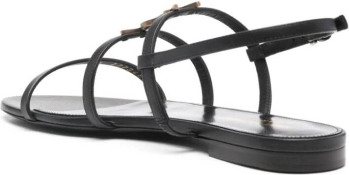 Saint Laurent Platte sandalen met goudkleurig logodetail Black Dames